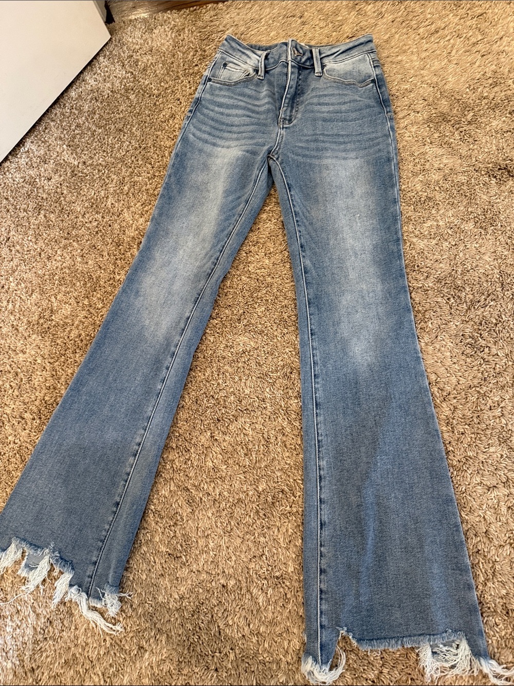 Light Blue High-Rise Flared Jeans with Raw Hem